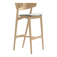 Light wood bar stool with a minimalist design and a soft gray upholstered seat. Ideal for modern décor.