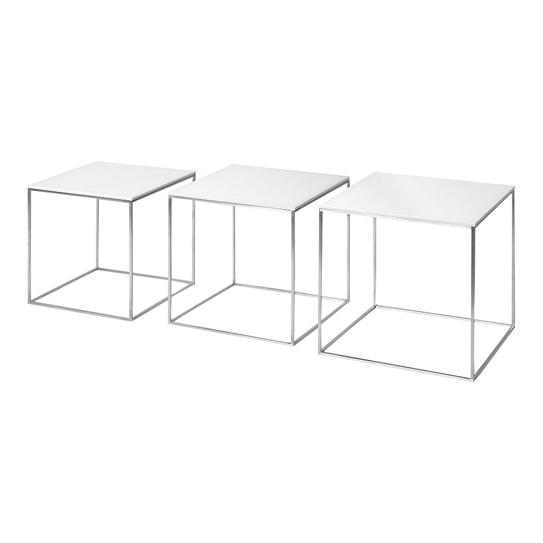 Set of three minimalist white tables with sleek metallic wire frames, perfect for modern decor.