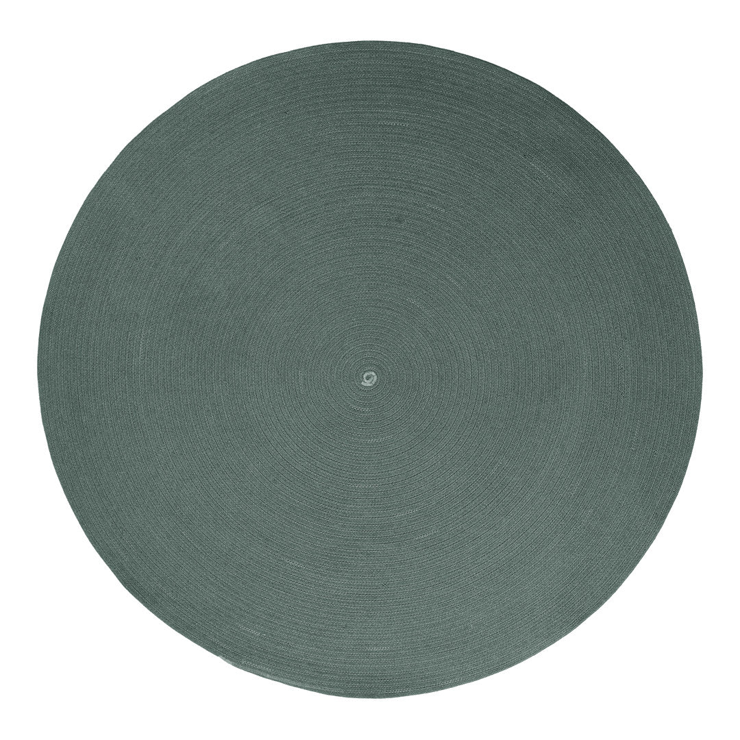 Round green woven rug with a textured design; perfect for modern and rustic decor styles.