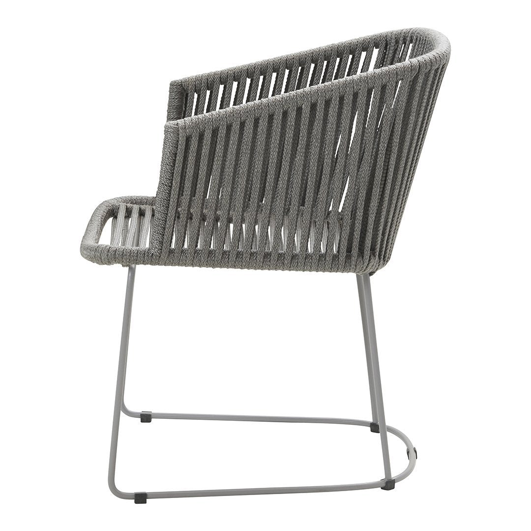 Gray ribbed chair with sleek metal frame, featuring a modern design and contemporary style. Perfect for indoor or outdoor use.