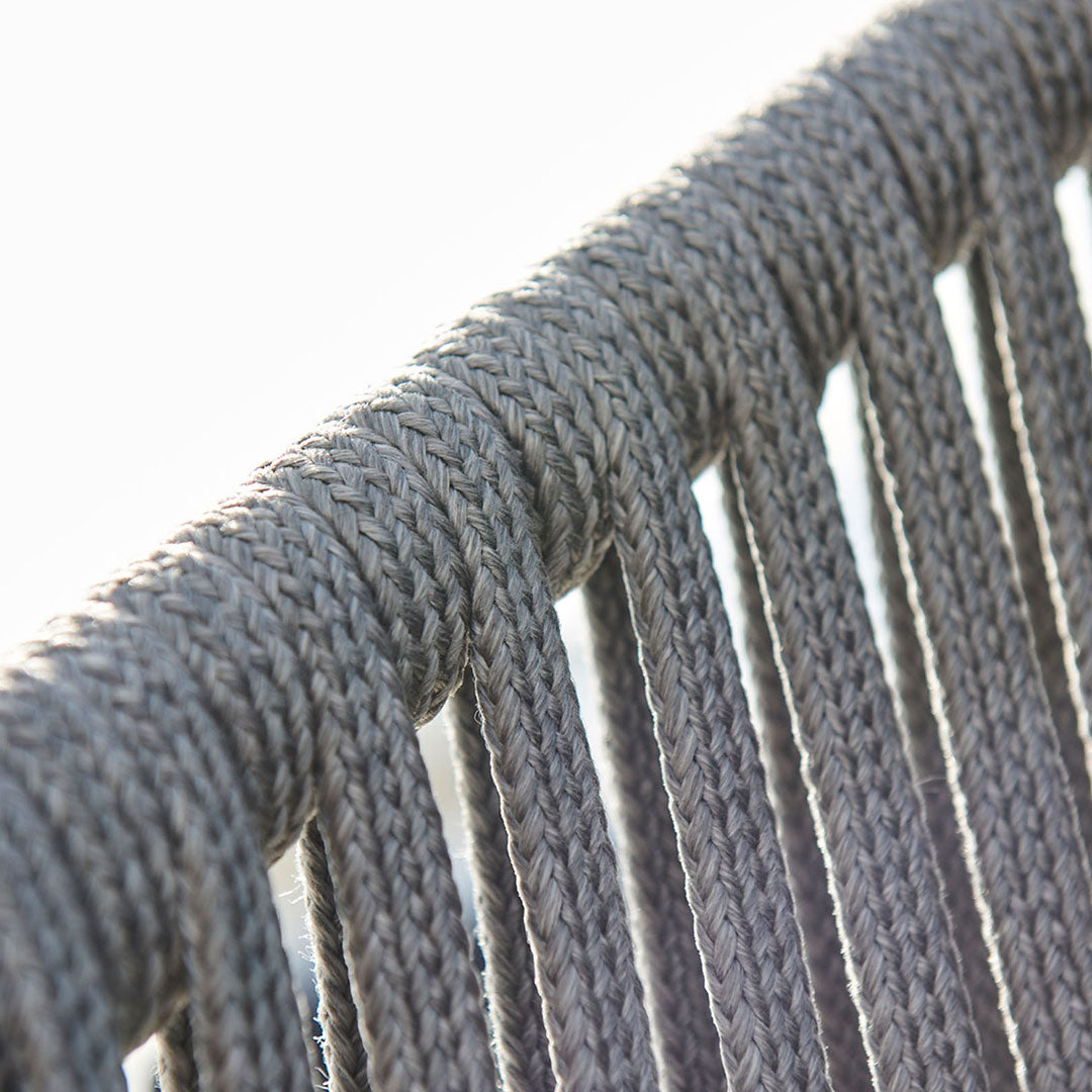 Gray woven rope close-up, showcasing a textured pattern and intricate detailing in a modern design.