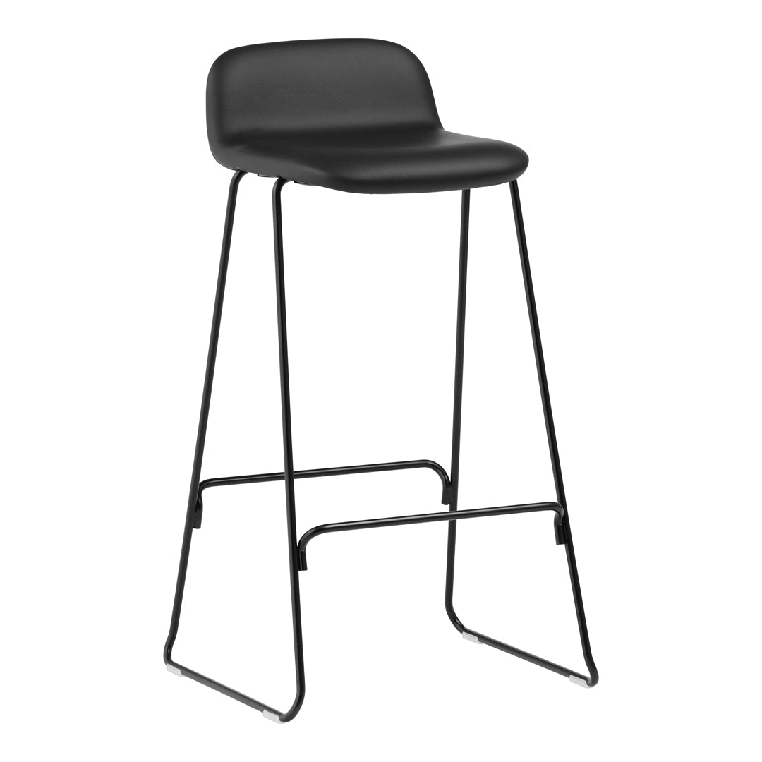 Black bar stool with a sleek design, featuring a matte finish and minimalist black metal legs.
