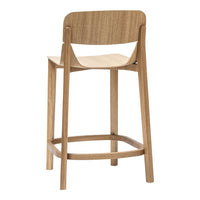 Natural wood bar stool with a smooth light oak finish and minimalist design. Elegant and modern aesthetic.