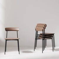Light wood grain tabletop with a smooth finish, complemented by sleek silver metal bases. Modern and minimalistic design.