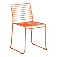 Bright orange slatted metal chair with a modern design, perfect for stylish indoor or outdoor seating.
