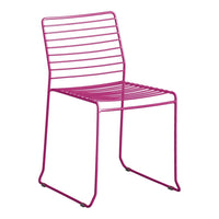 Vibrant pink metal chair with sleek, modern striped design, perfect for contemporary decor.