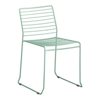 Mint green metal chair with a sleek, minimalist design featuring horizontal slatted patterns. Perfect for modern decor.