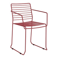 Red striped metal chair with a modern design, featuring an open framework and sleek lines. Perfect for outdoor spaces.