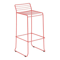Red metal bar stool with a sleek striped pattern and modern design. Perfect for contemporary spaces.
