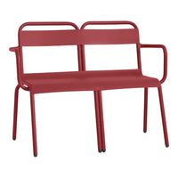 Red metal bench with a sleek, modern design and minimalist lines, ideal for outdoor or contemporary indoor settings.