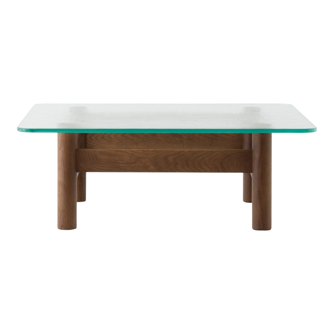 Modern glass top coffee table with a warm brown wooden base; sleek lines and minimalist design. Perfect for stylish living rooms.