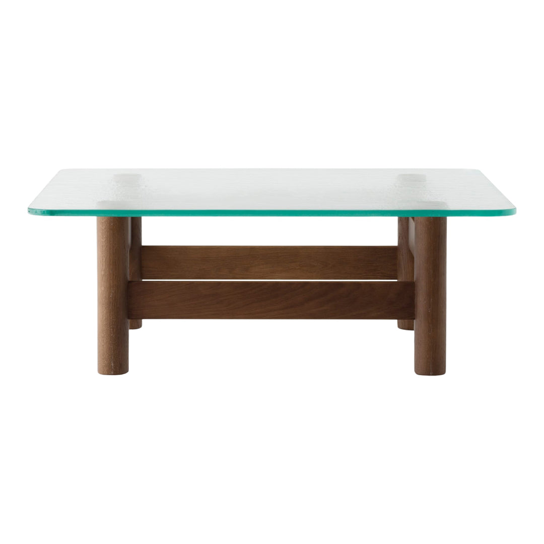 Glass top coffee table with brown wooden legs; sleek, modern design with minimalistic style.
