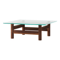 Square glass coffee table with a sleek, transparent top and rich brown wooden legs, featuring a modern, minimalist design.