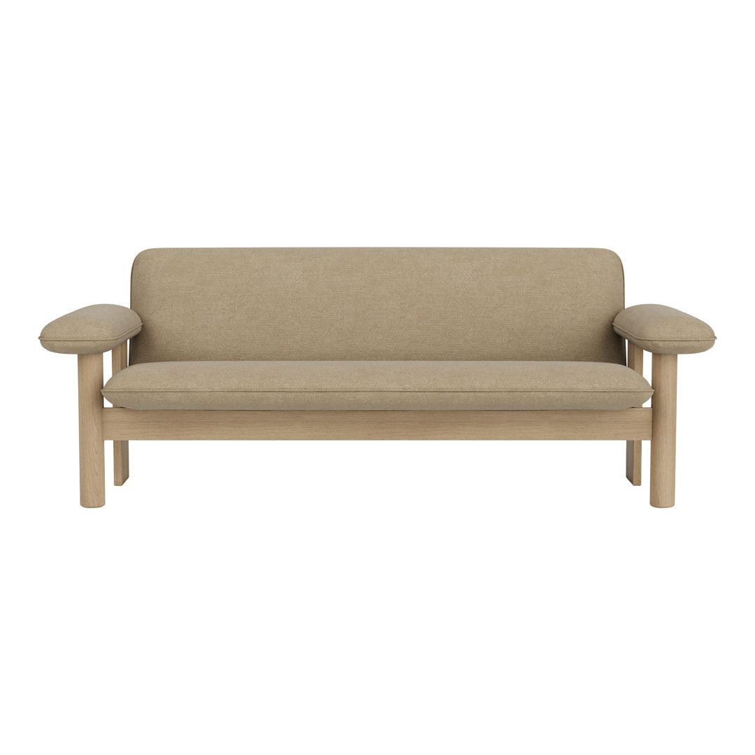 Beige upholstered sofa with light wood accents and a simple, modern design. Ideal for minimalistic decor.