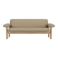 Beige upholstered sofa with light wood accents and a simple, modern design. Ideal for minimalistic decor.