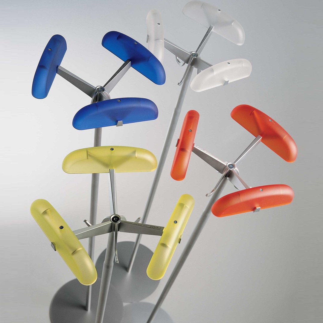Colorful display of vibrant blue, yellow, orange, and clear patterns on modern stand, showcasing a variety of shapes.