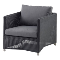 Gray wicker armchair with a matching cushion, featuring clean lines and a modern design. Perfect for contemporary spaces.