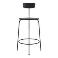 Black metal bar stool with a simple, minimalist design and smooth, uniform finishes. Perfect for modern decor.