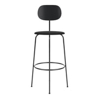 Sleek black bar stool with minimalist design, featuring a solid black seat and backrest against a slender frame.