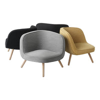 Modern accent chairs in black, gray, and mustard with smooth textured upholstery and wooden legs.