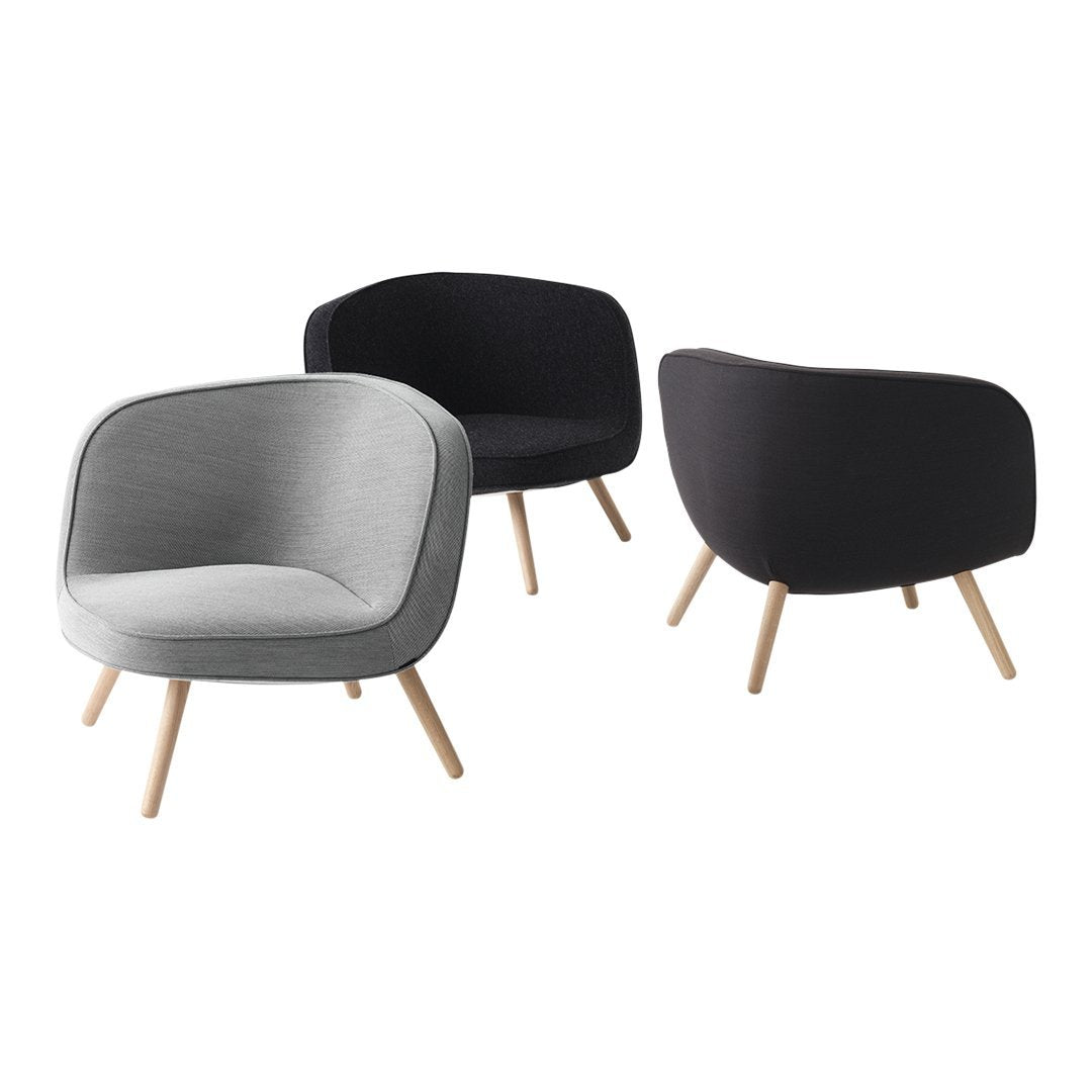 Set of modern armchairs in gray and black fabric with natural wood legs, featuring a smooth, sleek design.