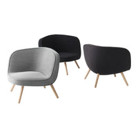 Set of modern armchairs in gray and black fabric with natural wood legs, featuring a smooth, sleek design.