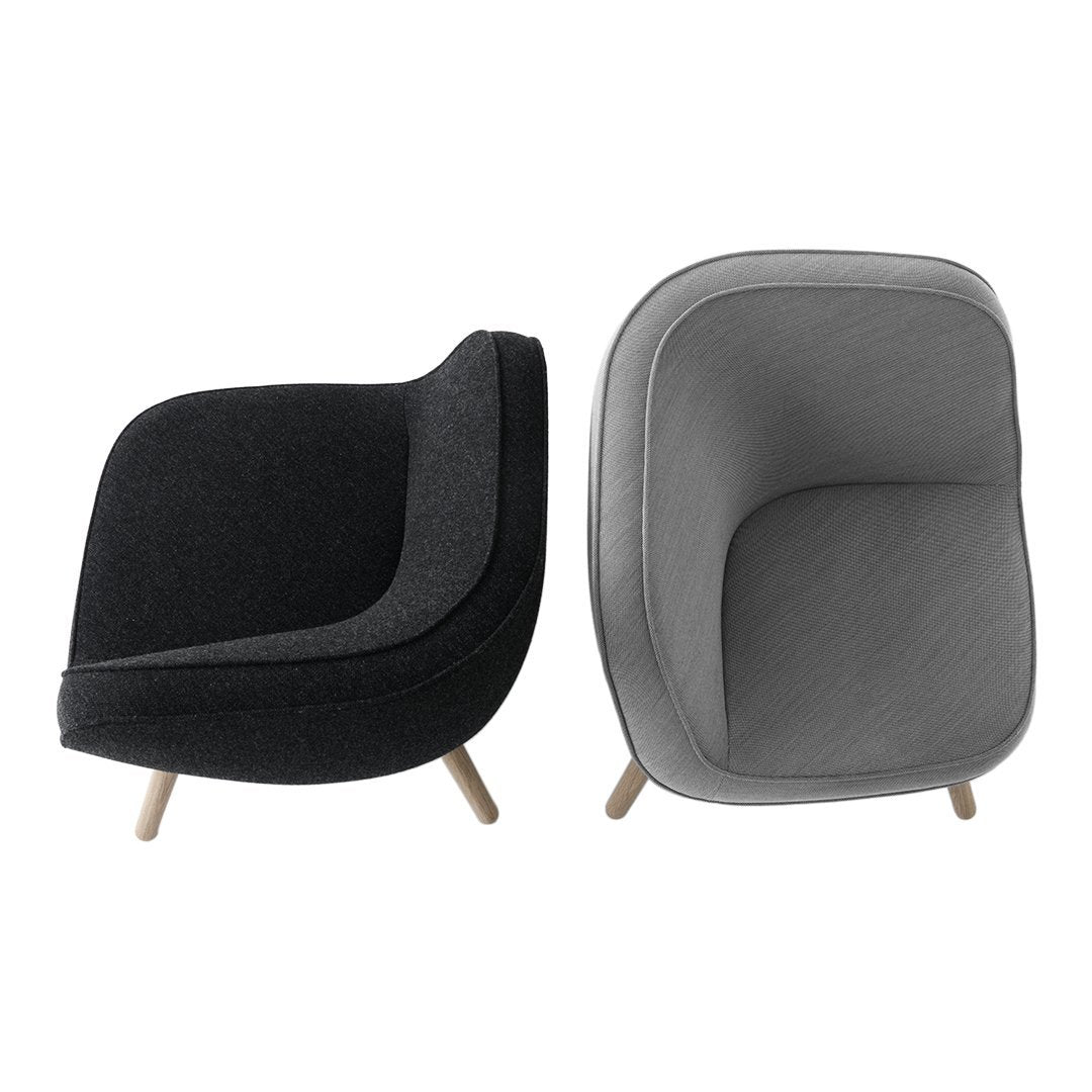 Two modern armchairs featuring a sleek black and soft gray fabric with minimalist design and wooden legs.