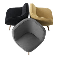 Three armchairs in black, gray, and mustard yellow fabrics with sleek modern designs and wooden legs.