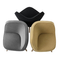 Set of three modern armchairs in black, gray, and mustard yellow, showcasing smooth textures and contemporary design.