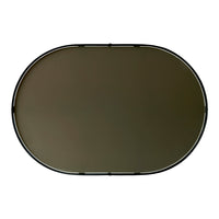 Oval matte green table with a sleek black frame, perfect for modern decor.