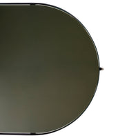 Round black mirror with a sleek, dark green reflective surface, perfect for modern decor.
