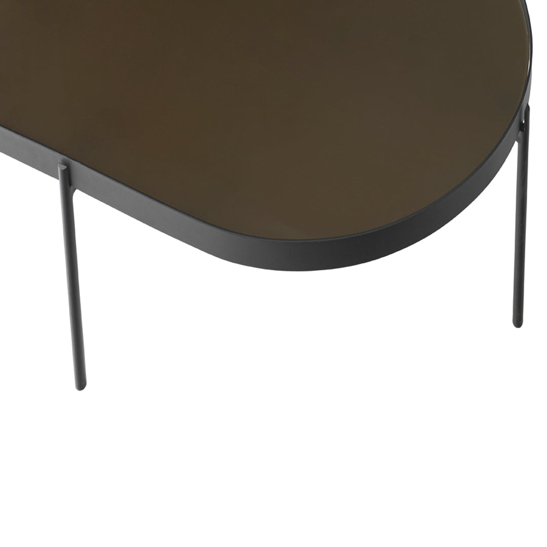 Sleek black metal table with a smooth, dark brown surface and minimalist design. Ideal for modern spaces.