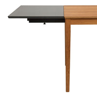 Wooden table with a light brown finish and a contrasting black tabletop section, featuring a sleek modern design.