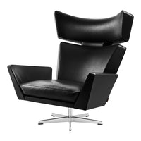 Black leather armchair with sleek lines and a stylish chrome base, perfect for modern decor.