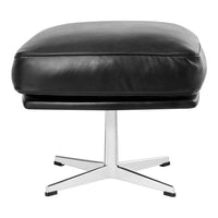 Black leather ottoman with sleek chrome base, featuring a minimalistic design and smooth finish. Perfect for modern decor.