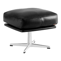 Black leather ottoman with a smooth cushion and sleek silver metal base. Modern design with minimalistic elegance.