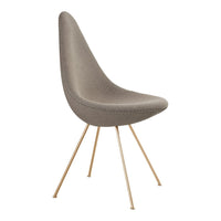 Gray upholstered chair with a sleek design and gold metal legs, featuring a smooth, minimalist pattern.