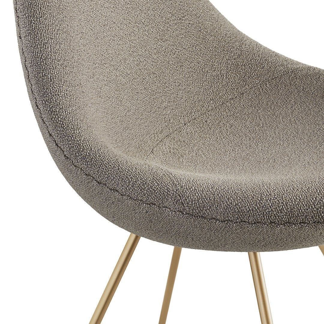 Gray textured chair upholstery with subtle pattern and stylish gold metal legs.