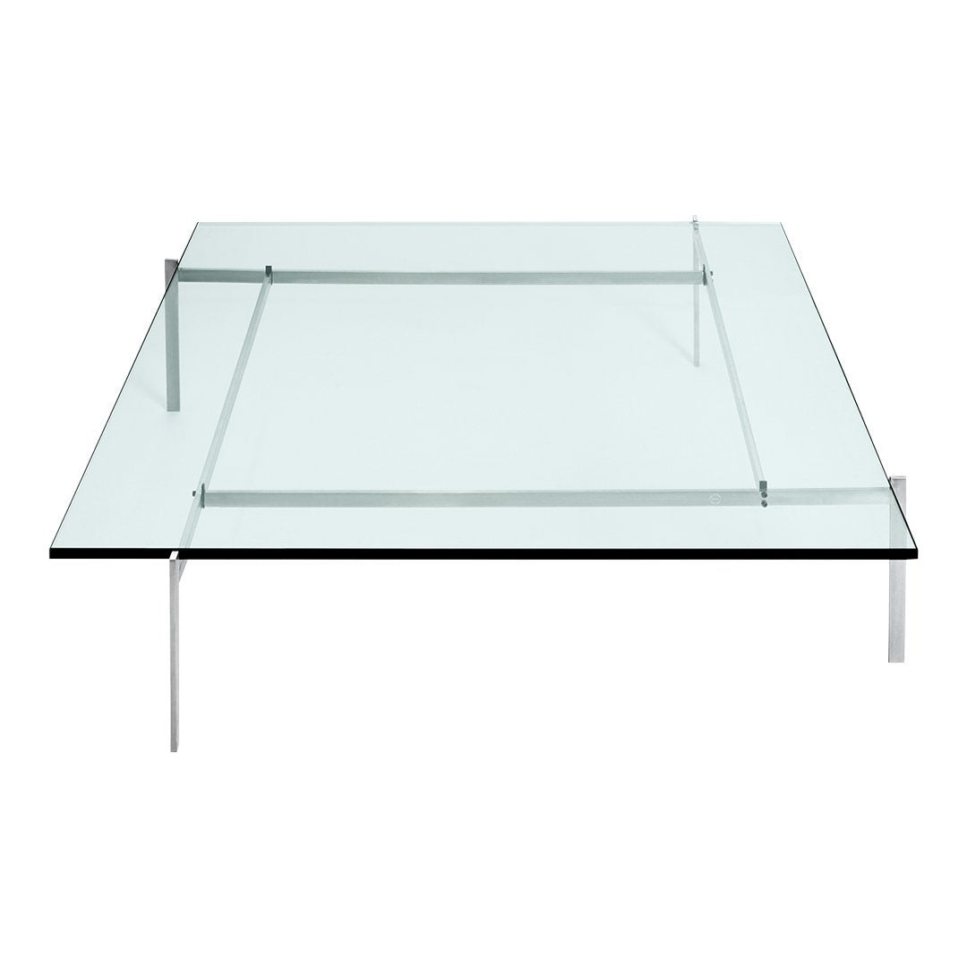 Clear glass coffee table with sleek stainless steel legs and minimalist design, showcasing modern elegance and simplicity.