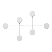 White geometric wall decor with circular accents, featuring a modern and minimalist design.