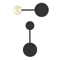 Black and gold geometric earrings featuring circular shapes and sleek lines, perfect for modern style.