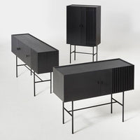 Stylish black wooden cabinets with sleek lines and subtle vertical slats on a modern metal frame. Perfect for any decor.