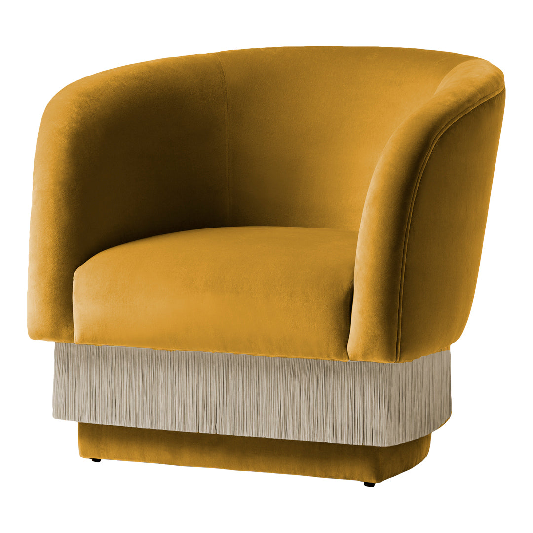 Velvet armchair in rich mustard yellow with a stylish fringe trim in light beige. Perfect for modern decor.