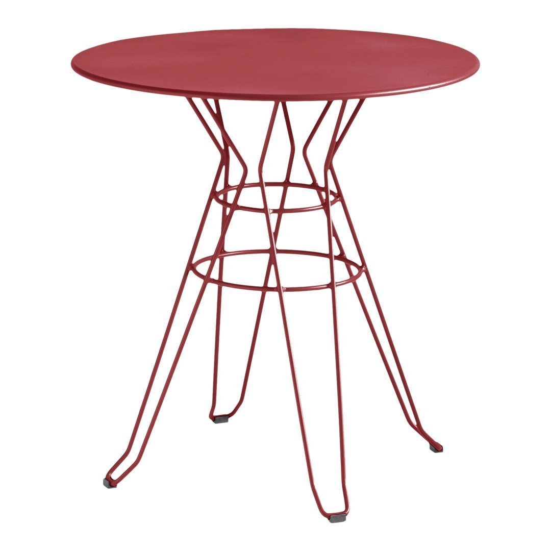 Red round table with a modern wire base, featuring a sleek and minimalist design. Perfect for contemporary decor.