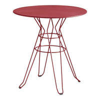 Red round table with a modern wire base, featuring a sleek and minimalist design. Perfect for contemporary decor.