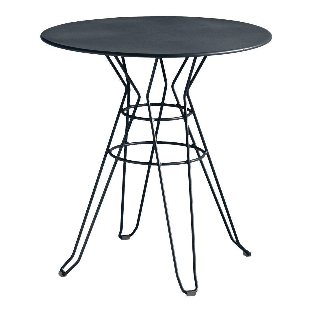 Round black metal table with a sleek, minimalist design featuring a wire base and smooth tabletop. Perfect for modern decor.