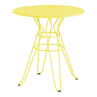 Bright yellow round table with a geometric wire design and sleek legs, perfect for modern decor.