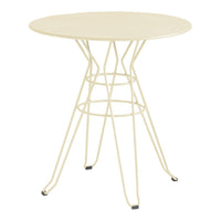 Cream-colored round table with a geometric wire base, perfect for modern decor. Ideal for indoor or outdoor use.