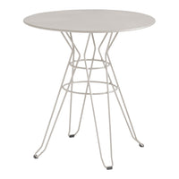 Round white table with a sleek, minimalist design featuring a geometric wire base. Perfect for modern decor.
