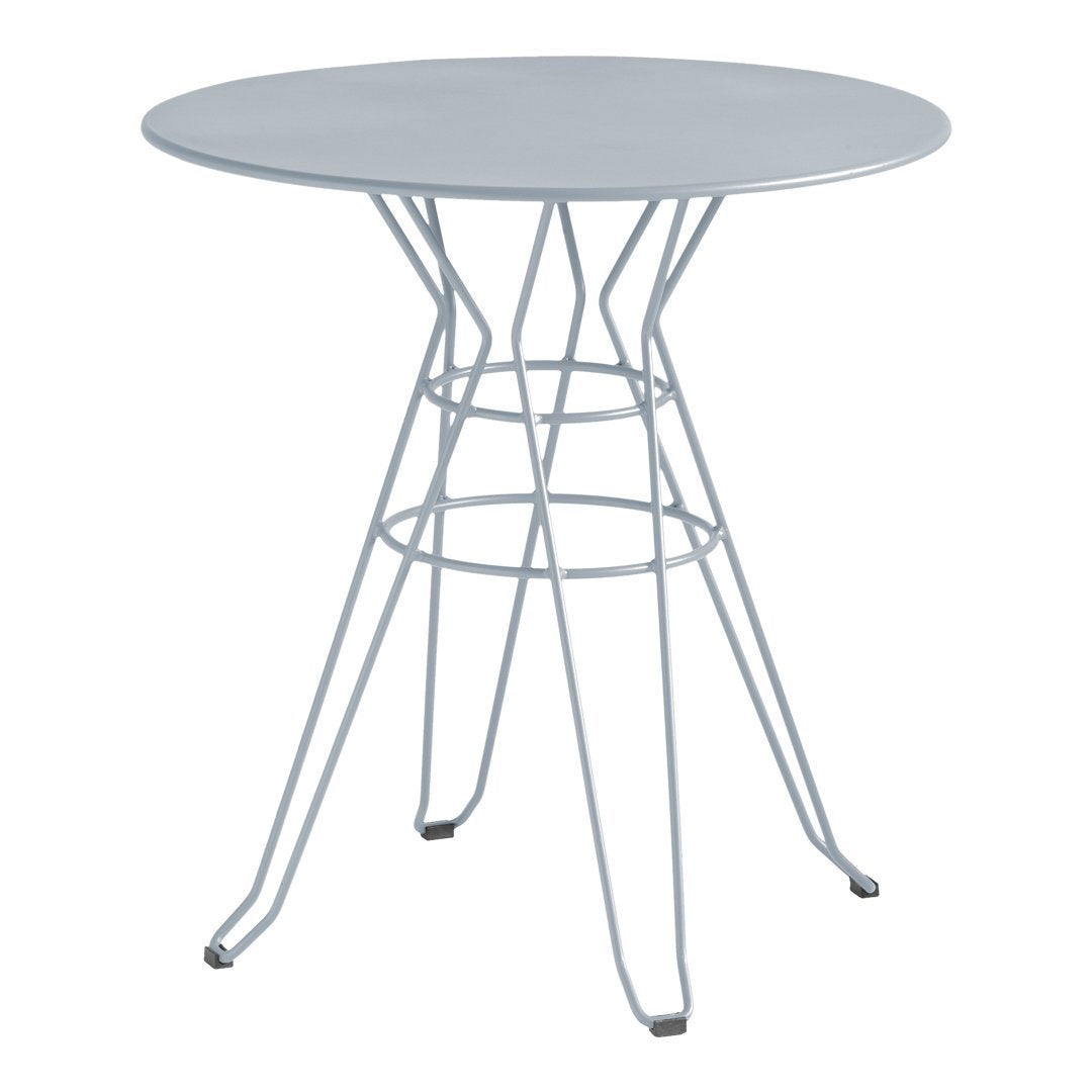 Round silver metal table with a modern wire base, featuring a sleek, minimalist design and smooth surface.